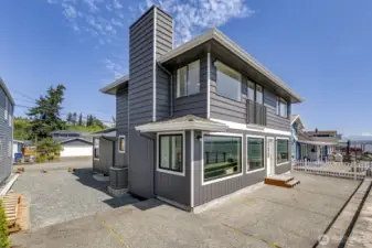 Can you see your hammock and BBQ? What a great place to hang out. The big windows above are the primary bedroom with the sliding glass door so you can see the waves while lying in bed.