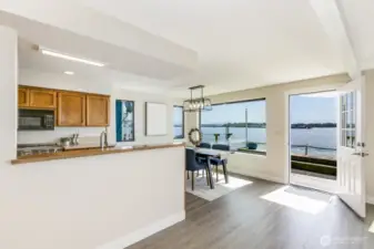 Open & airy, the kitchen looks out to the water.