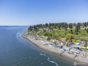 Hat Island is in the distance to the left and Whidbey Island is beyond that. Great beach walking. Note that the water is deep enough for mooring buoys. You can see the bonus / multi-purpose room over the garage.