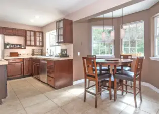 Open, light filled kitchen with breakfast nook.