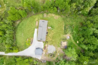 The trail system entrance is to the right of the backyard. Room for exploring, riding dirt bikes, or even hunting in your own backyard.