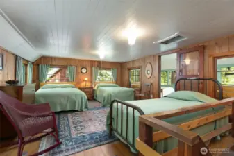 Large Open Sleeping Area with Lake and Forest Views