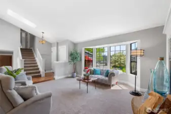 Looking toward the entry way you get your first glimpse of the beautiful acacia wood flooring and Tiffany style chandelier in the entry. Nice wide entryway makes greeting your guests easy and the handy coat closet helps you stay organized.