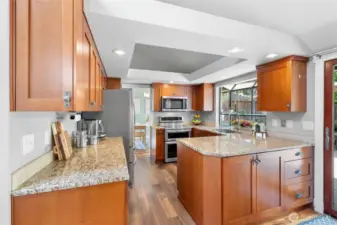Notice the great use of space with the additional cabinets on the outside of the kitchen. So handy! Also please notice the lovely garden window. Excellent for growing herbs, succulents, or just keeping an eye on the backyard happenings.