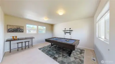 Bright and spacious bonus room offers endless possibilities—perfect as a game room, home theater, hobby space, or second living area with a large windows bring in plenty of natural light.