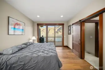 Main floor primary suite - slider to deck.