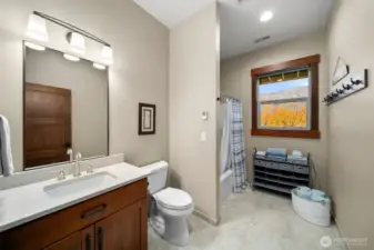 Full bath with heated tile flooring.