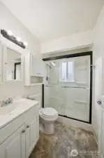 Bathroom on main level with newer oversized shower.