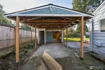 Covered carport and detached garage.