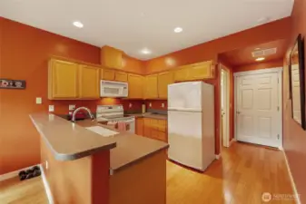 Durable and Gorgeous Bamboo Flooring in Dining Room, Kitchen & Hallway to Two-Car Garage!