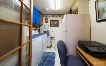 Laundry room and extra pantry storage.