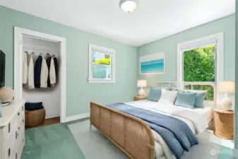 One of two downstairs bedrooms, this room is carpeted with a peaceful view of the backyard. This is a virtually staged image.