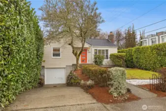 Adorable bungalow with one car garage and driveway parking