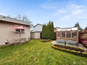 Fully Fenced Backyard w/ Green House and Garden Space