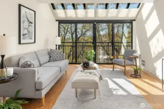 Natural light fills the living room through floor-to-ceiling windows and doors, enhanced by elegant atrium outdoor shades.