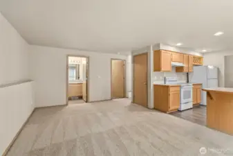family room, looking towards half bath and utility room/garage