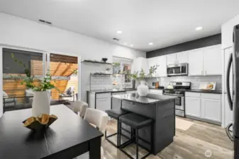 Whether you're hosting an intimate dinner or entertaining a group, the open floor plan offers effortless flow indoors and out to the covered deck.