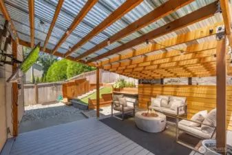 An entertainer’s dream—enjoy year-round gatherings on the covered deck with a wall-mounted TV, fire pit, playhouse with built-in slide, and an upper sundeck. What more could you ask for?