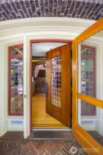 The beautifully detailed front door opens to invite you into a home filled with timeless character.