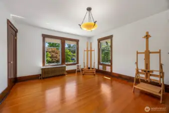 Versatile second-floor room with an original light fixture, perfect as a bedroom or creative space.
