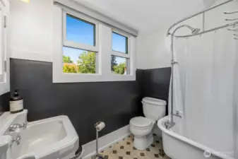 The third-floor bathroom features a shower and patterned tile.