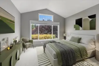 Vaulted ceilings in this large bedroom on upper floor (virtually staged