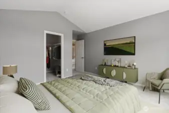 Vaulted ceilings in this large bedroom on upper floor (virtually staged
