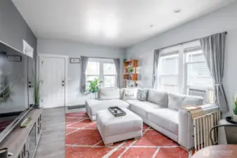 The living room space provices wonderful natural light with the large beautiful windows with ample space for entertaining.