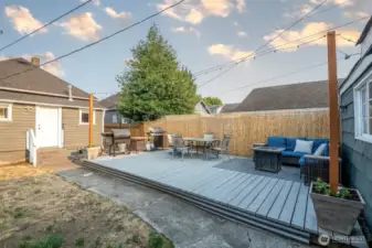 This view shows how the back deck is steps away from the mud room and right into the kitchen for easy outdoor living.
