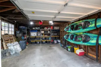 The inside of this garage has ample space for storing all your toys AND your car AND it has a man door to enter and exit the backyard in addition to the gate from the ally to the backyard.