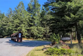 The entrance to the Orcas Highlands and the community mailboxes. You will also find a Little Free Library here! The local school bus also stops at this location.
