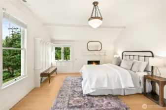 Primary is sunlit and has cool fireplace. Large updated bath with refurbished clawfoot tub and massive walk in closet.