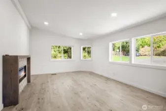 Main living area with fireplace and custom built mantle.