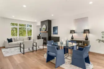 Statement fireplace connecting the dining and living rooms