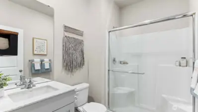 Bathroom downstairs features a walk-in shower. Pictures are for representational purposes only, colors and features may vary.