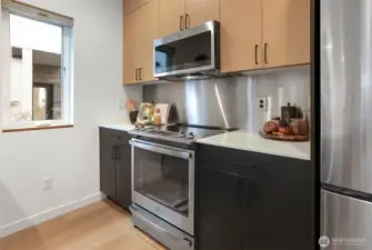 Easy-care Quartz counters, good ventilation and an opening window for air flow.