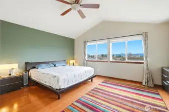 Spacious primary bedroom on the upper level with 5 piece bath and convenient laundry room with 5 piece bath and convenient laundry room