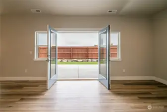 French doors onto rear patio of like home