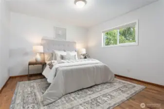 Beautiful original hdwd floors in main bedroom - flooring appears to be under most carpet in home