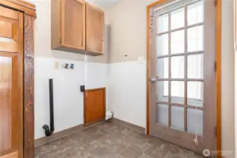 Utility room just off kitchen, can enter right off carport