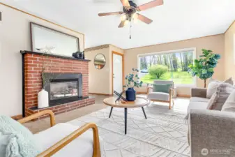 Cozy gas fireplace w/original brick surround