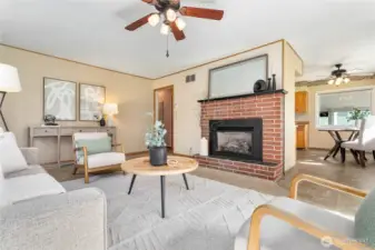 Dining just off kitchen & open to living room; hall to left leads to bedrooms & bathroom