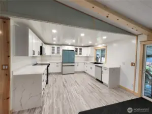 New kitchen with soft close white shaker cabinets and waterfall counters!  Luxury, Lefton kitchen sink.  Samsung Bespoke appliances.  Stove & dishwasher 2025.