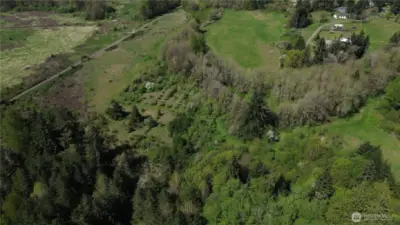 Lower field on the left, orchard, middle field and upper field with home and structures in upper right.