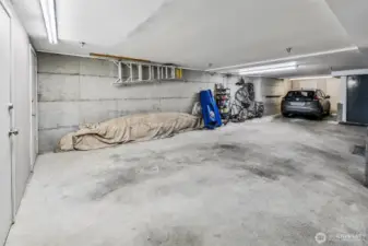 Spacious controlled access parking space, and not pictures; a huge private storage.