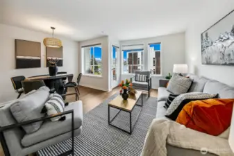 Living room has great width, meaning tons of windows and natural light. The furnishings all set up to maximize enjoyment of the view.
