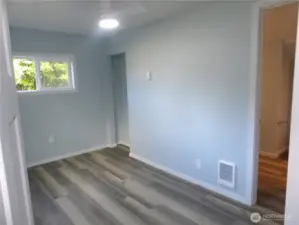 One of the two bedrooms.  This one has the bathroom attached at one door and the other door leads out to the living room.