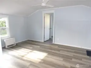 Leave the kitchen to cross the living room to bedroom on the south side of the house.
