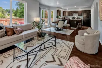 Expansive deck fits both outdoor dining & conversation area.