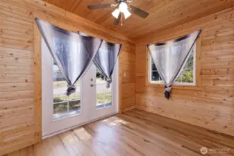 What a fun room!  It could be a great home office, art studio, cat room, whatever you need.